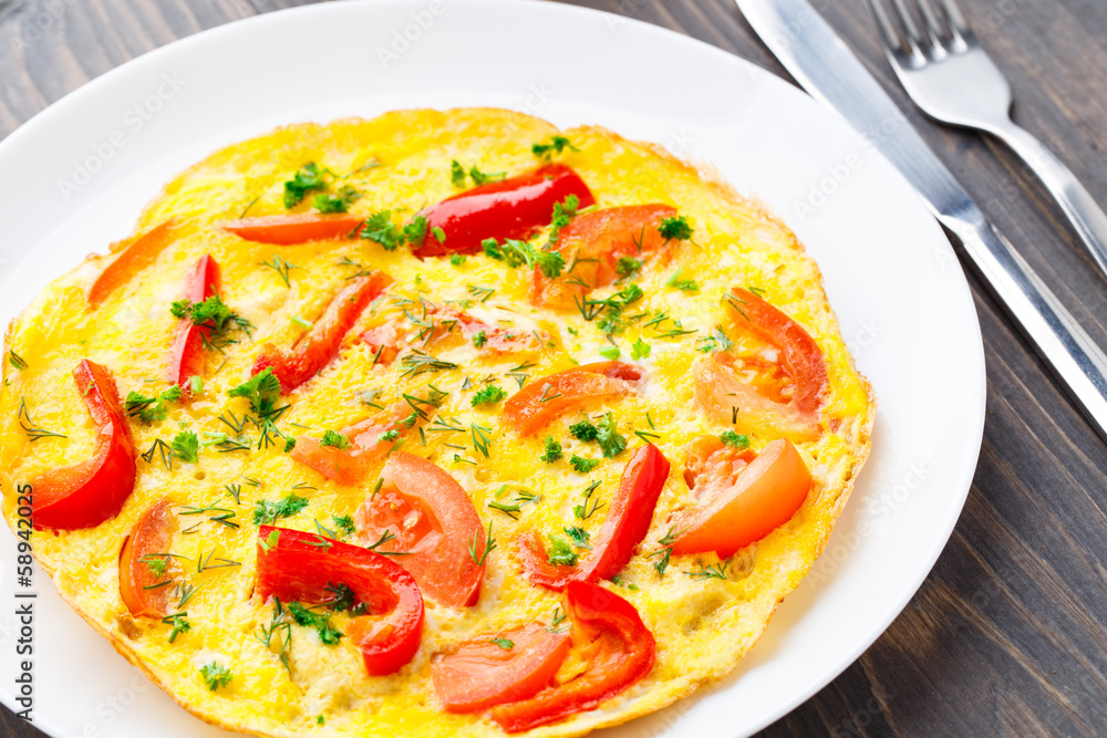 Omelet with paprika, tomato and herbs