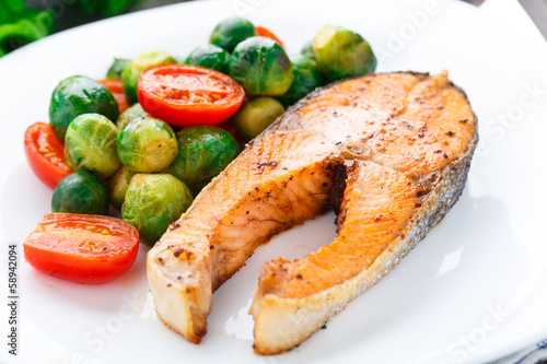 Salmon with roasted brussels sprout and tomato