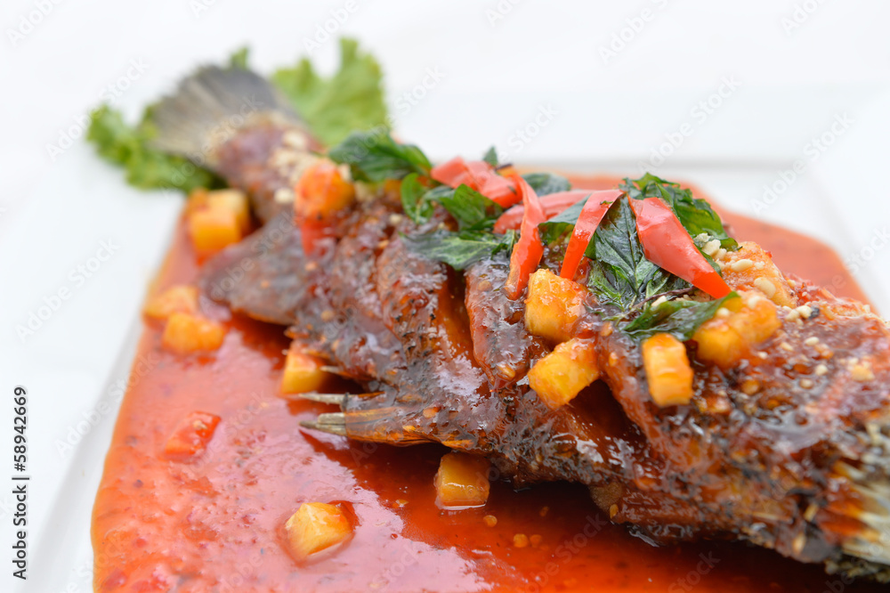 Fototapeta premium Fried snapper with chili sauce on the plate