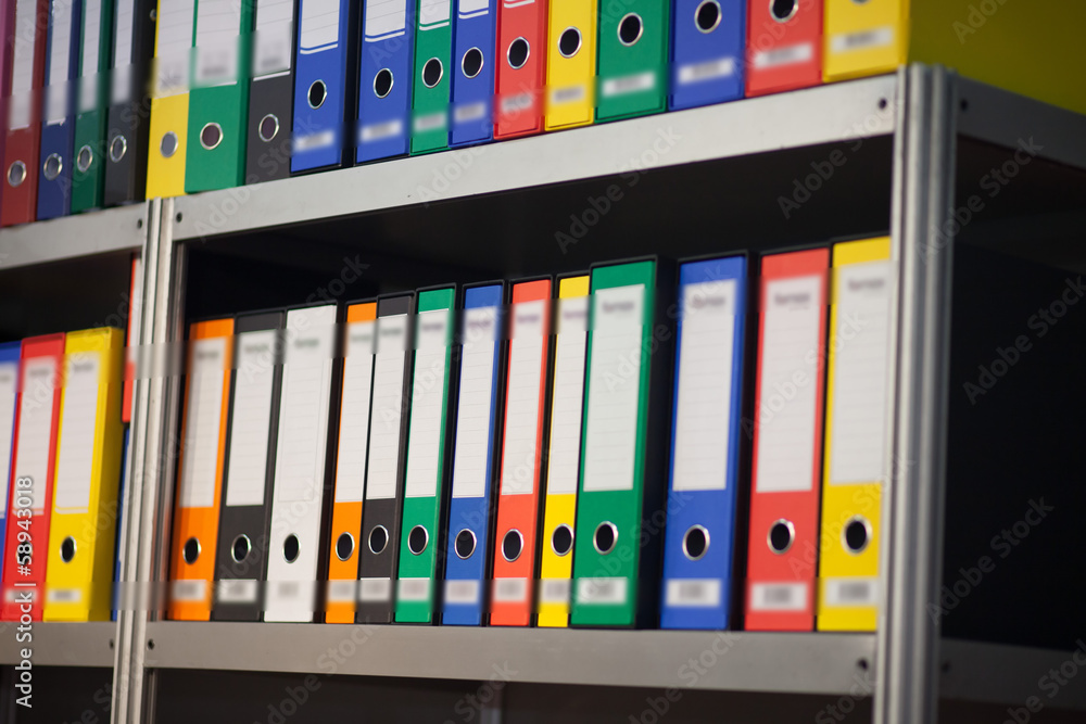 folders on bookshelf folders on bookshelf
