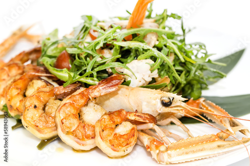 shrimp salad greens vegetables and crayfish in the restaurant