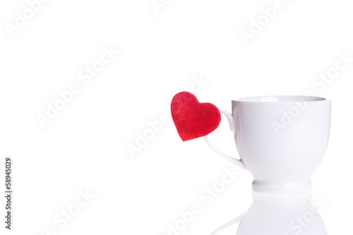 white cup with red heart on handle