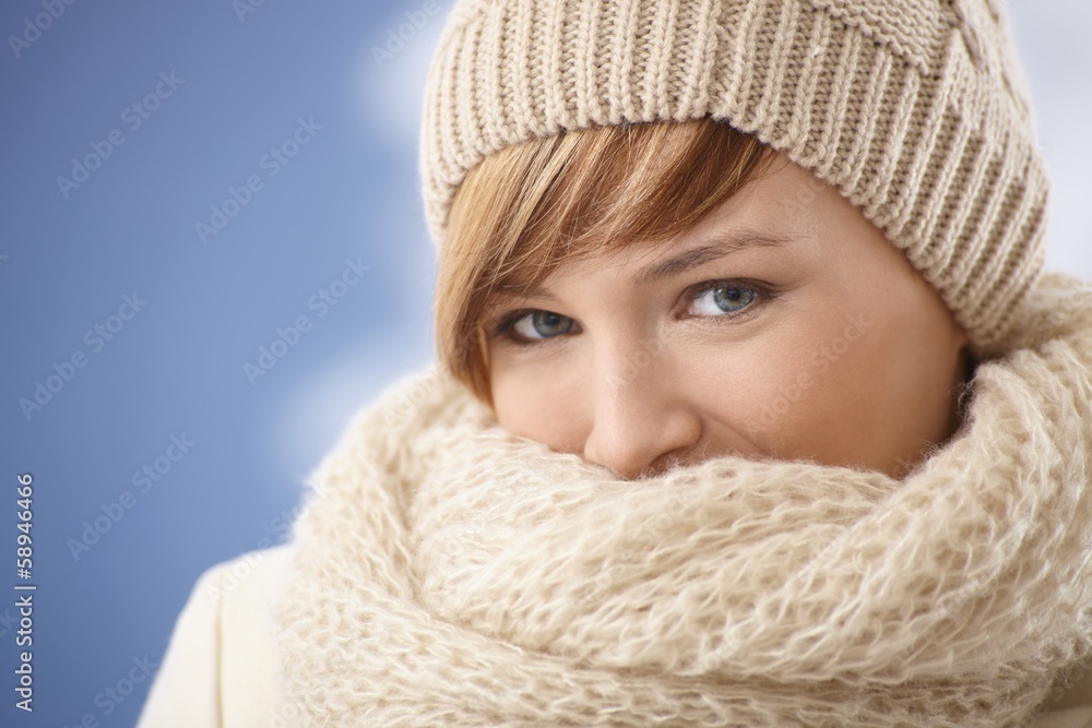 Young woman covering her face with shawl Young woman covering her face with shawl