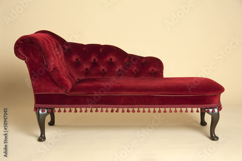 Tableau sur toile Chaise longue seat covered in a dark red velvet