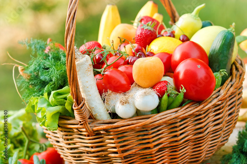 Wicker basket is full of fruits and vegetables