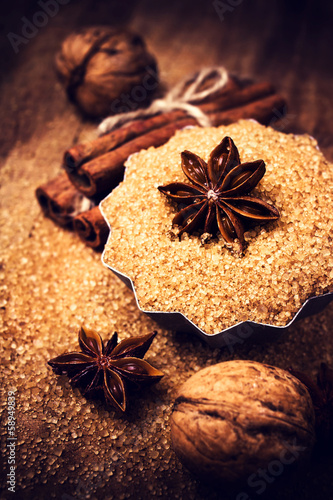 Brown sugar and Star Anise in a baking tray on wooden table, sti
