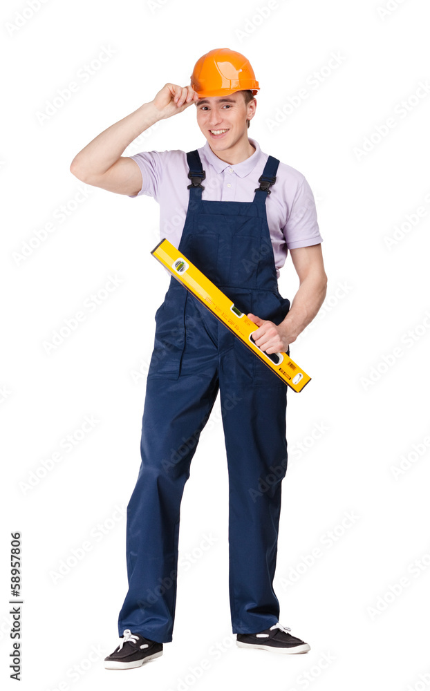 Engineer in orange hard cap hands engineer's level, isolated Engineer in orange hard cap hands engineer's level, isolated