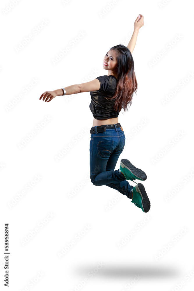 Attractive young woman jumping in the air