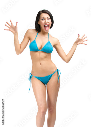 Full-length portrait of young woman wearing blue bikini © Karramba Production
