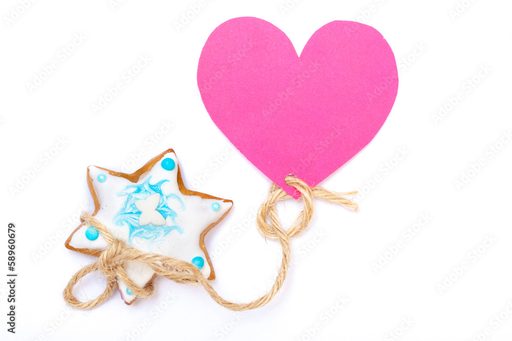 Christmas gingerbread cake star with icing decoration and heart