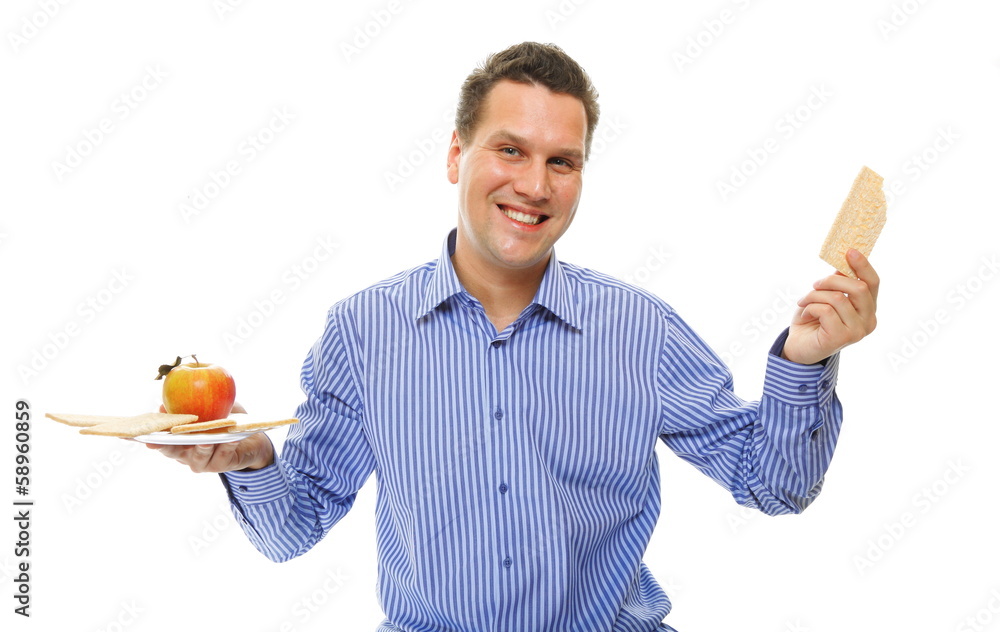 Healthy lifestyle man eating crispbread and apple Healthy lifestyle man eating crispbread and apple