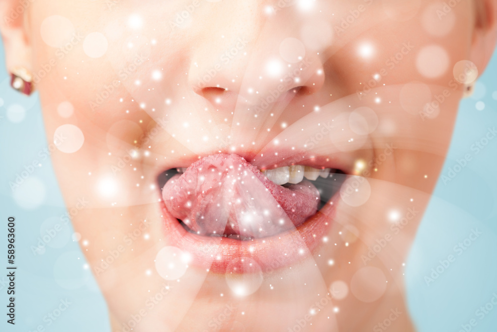 Pretty woman lips blowing abstract white lights Pretty woman lips blowing abstract white lights