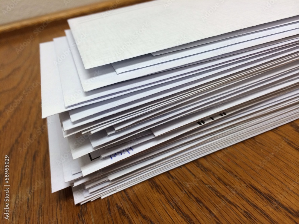 a stack of white envelopes at work ready to mail a stack of white envelopes at work ready to mail
