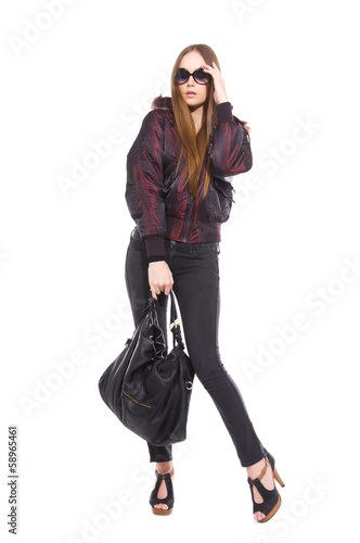 image of attractive young girl in sunglasses with bag