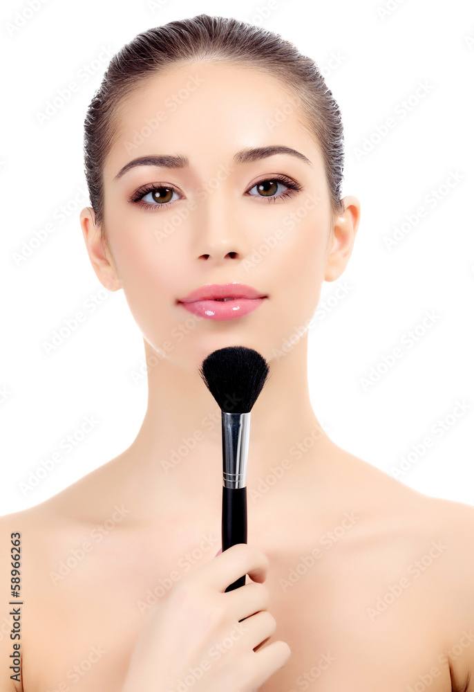 Female with cosmetic brush Female with cosmetic brush
