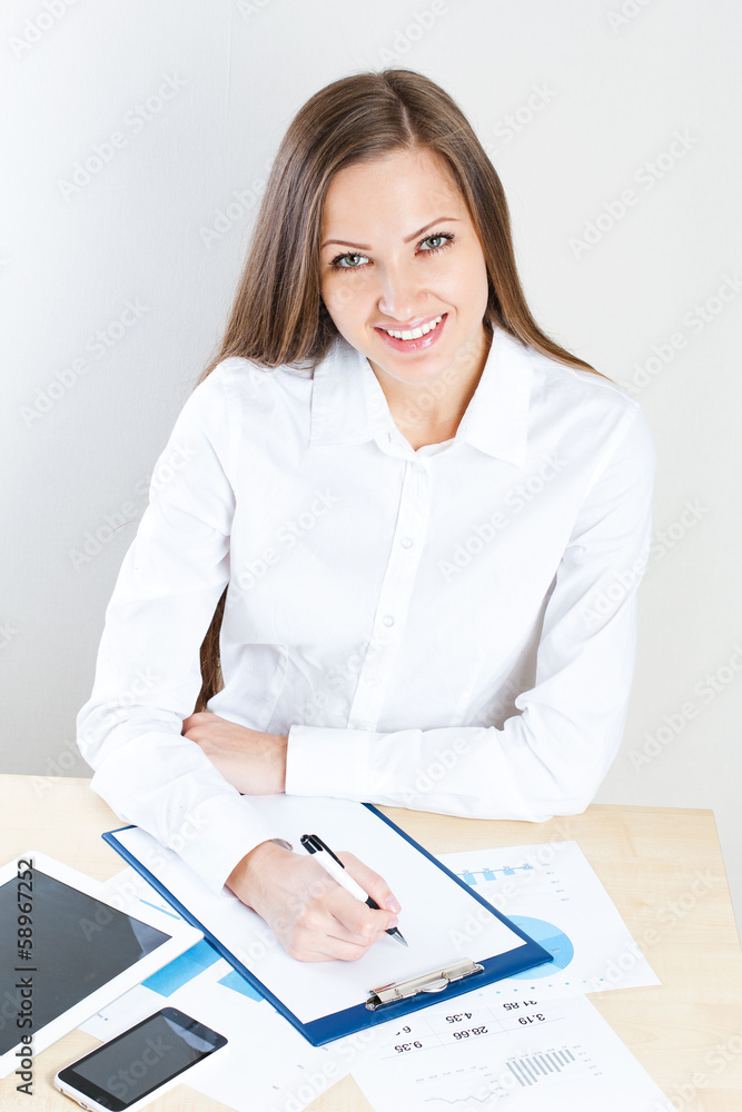 smiling business woman . office job . working at the office smiling business woman . office job . working at the office