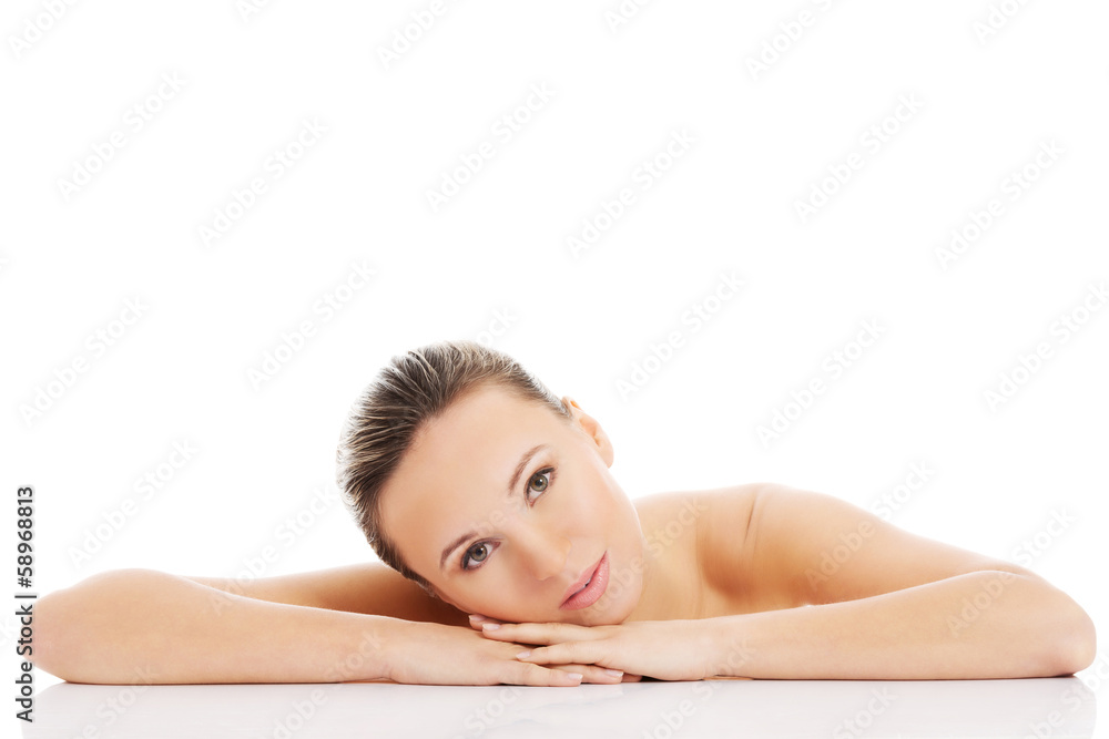 Beautiful nude woman is lying on her hands. Beautiful nude woman is lying on her hands.