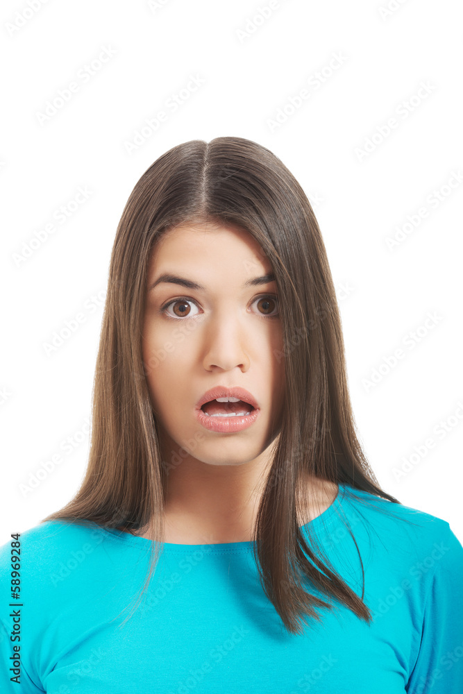 Young woman's portrait. She expresses shock. Young woman's portrait. She expresses shock.