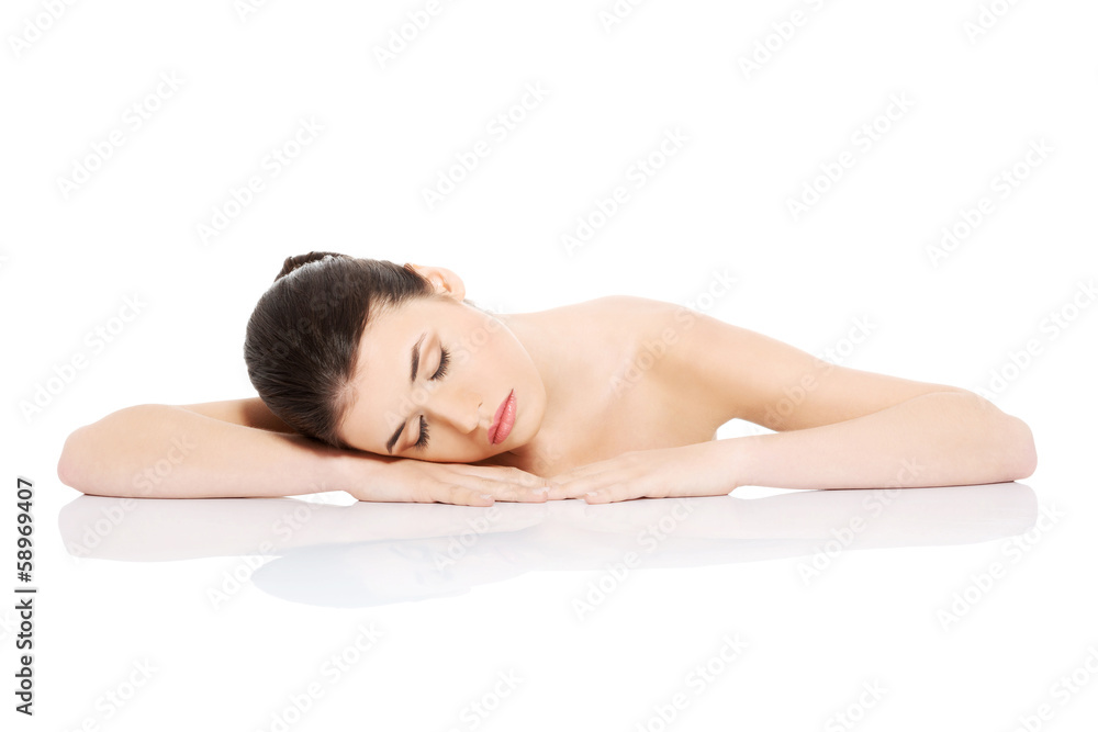 Portrait of a young beautiful nude woman lying on hands. Portrait of a young beautiful nude woman lying on hands.