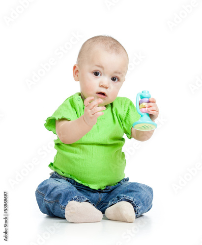 baby playing with musical toys isolated on white background