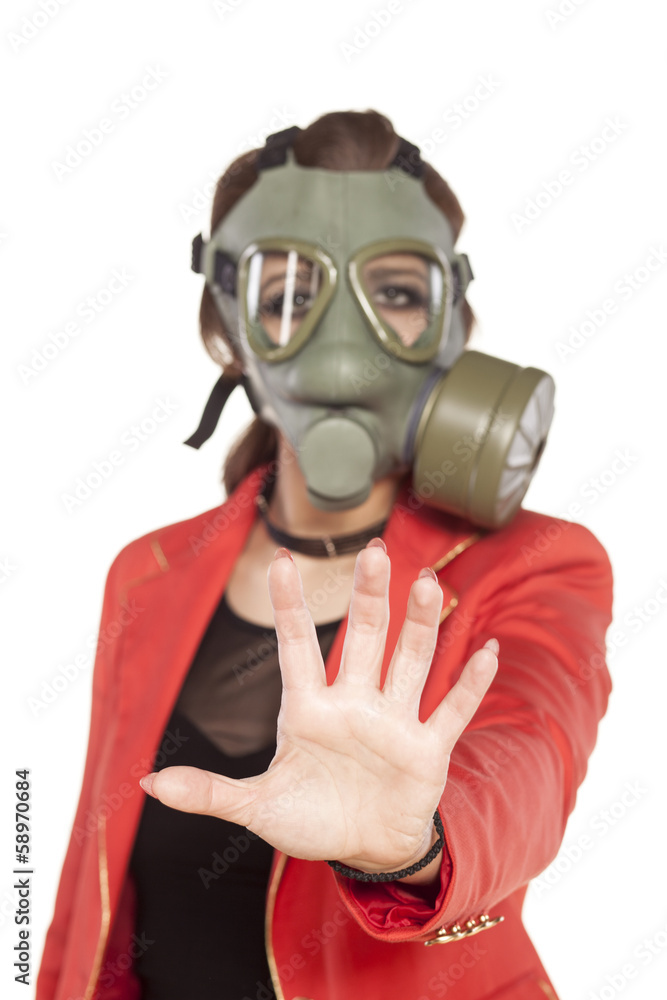 young business woman with a gas mask showing stop sign young business woman with a gas mask showing stop sign