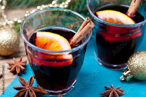 Mulled wine and spices with christmas decorations