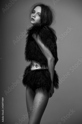 Fashion model pose on gray background