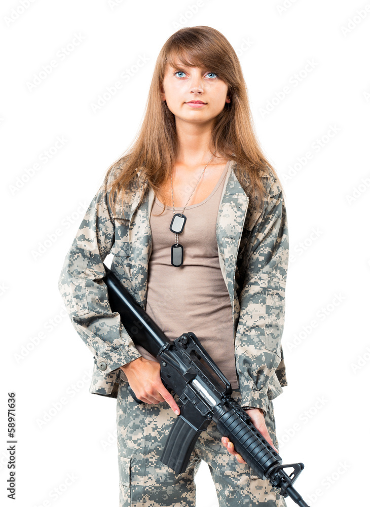 Soldier young beautyful girl dressed in a camouflage with a gun