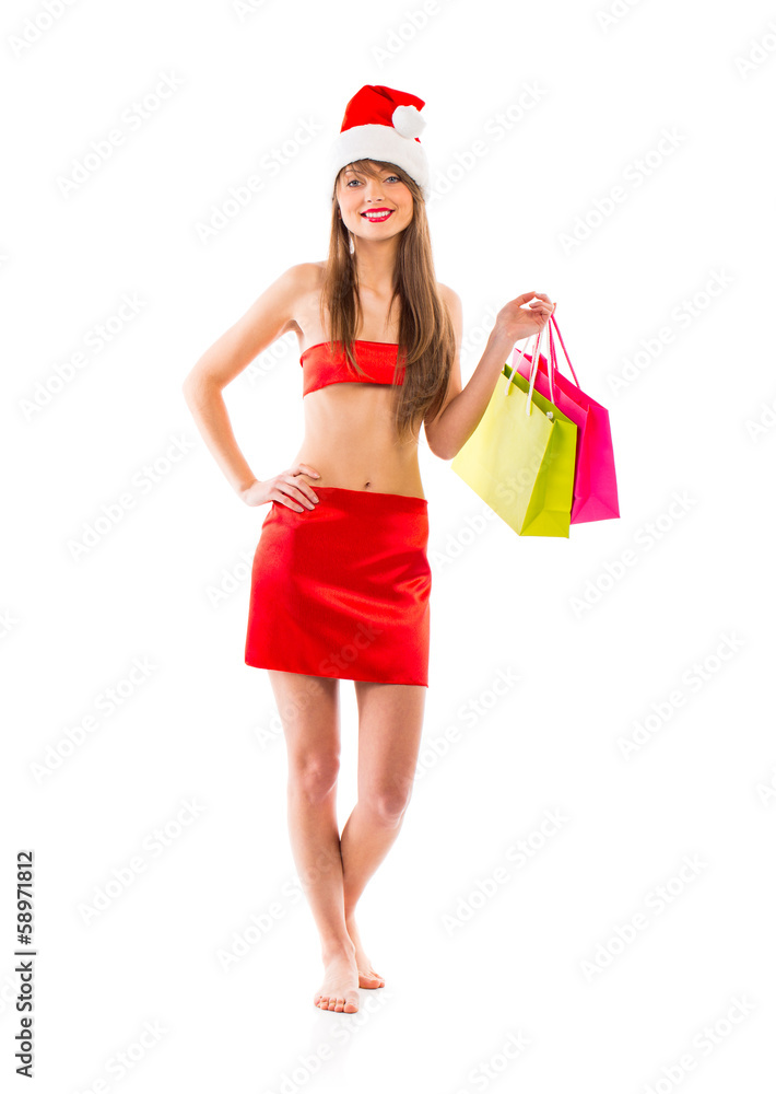 Beautiful Santa christmas girl with shopping bags on white Beautiful Santa christmas girl with shopping bags on white