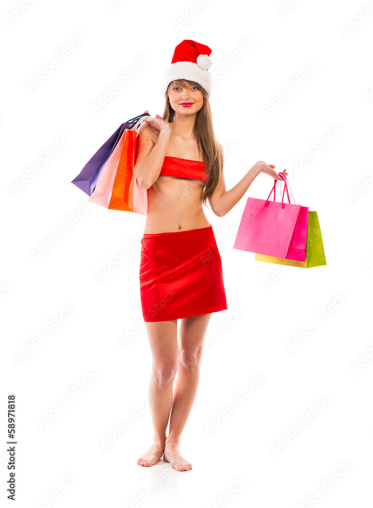 Beautiful Santa christmas girl with shopping bags on white Beautiful Santa christmas girl with shopping bags on white