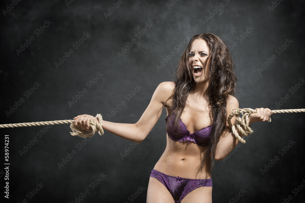 angry girl tied by rope