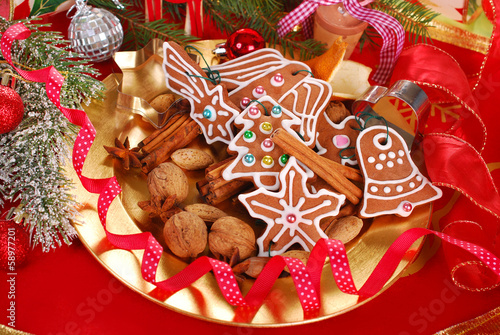plate with gingerbread cookies and spices for christmas