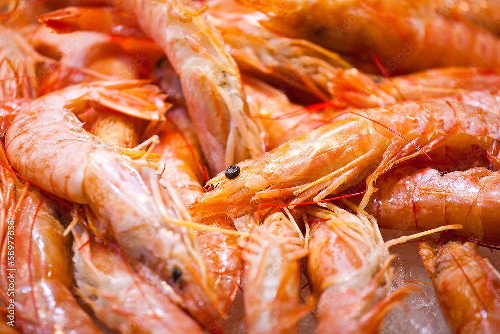 Bright shrimps laying on counter
