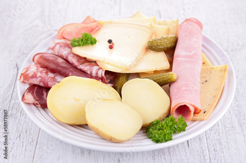 plate with cheese, ham, potato