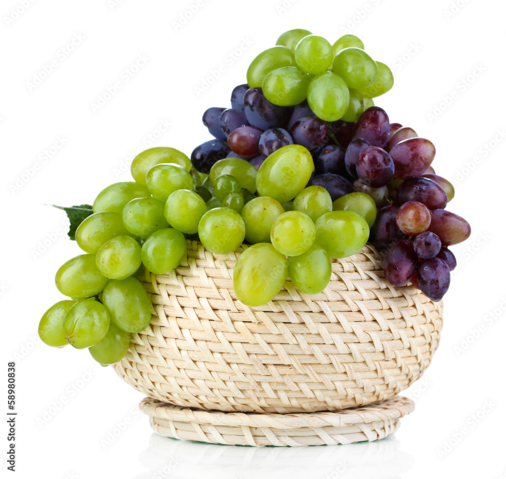 Ripe green and purple grapes in basket isolated on white Ripe green and purple grapes in basket isolated on white