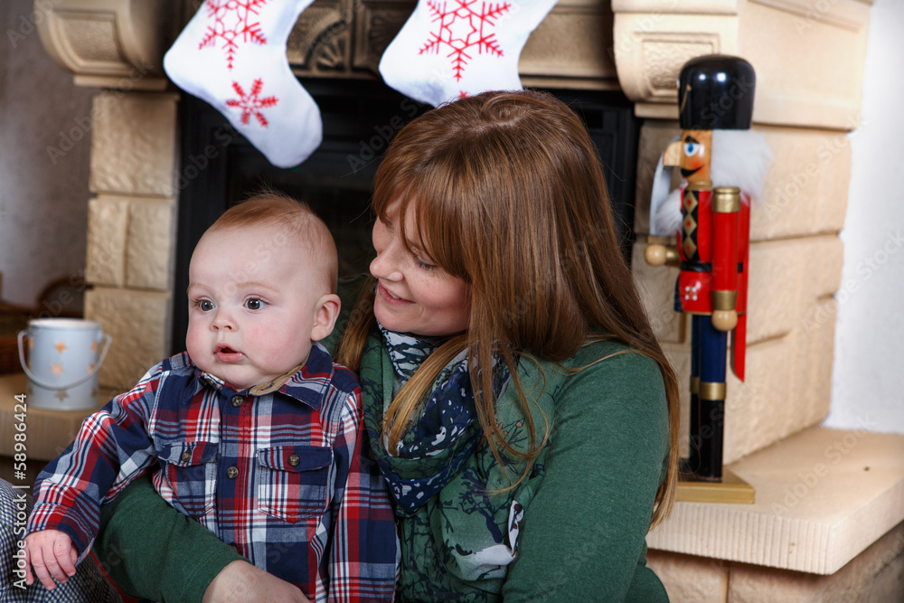 Beautiful young mother and adorable baby boy with Christmas deco Beautiful young mother and adorable baby boy with Christmas deco