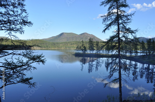 Landscape with a lake and mountains along the banks.