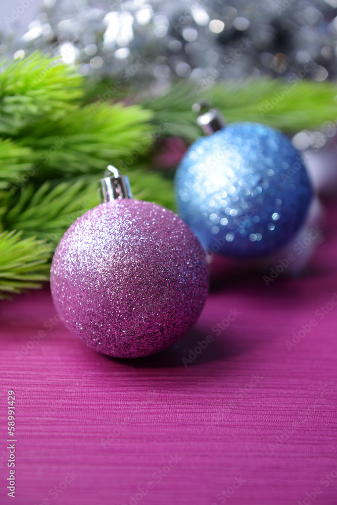 Christmas balls on fir tree, on color background Christmas balls on fir tree, on color background