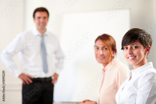 Professional executive group smiling at you