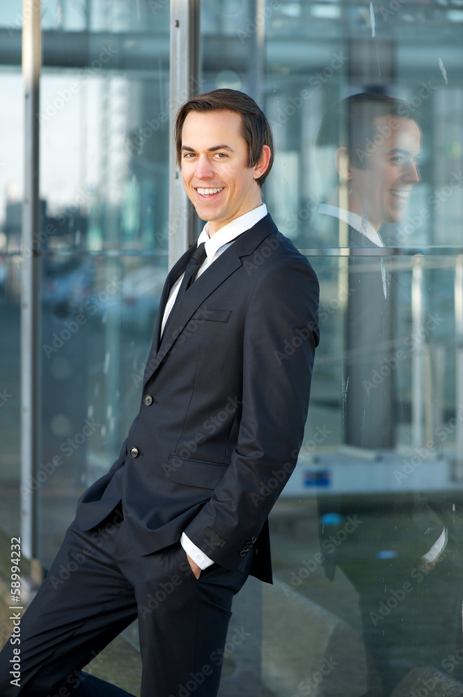 Young businessman smiling outdoors Young businessman smiling outdoors