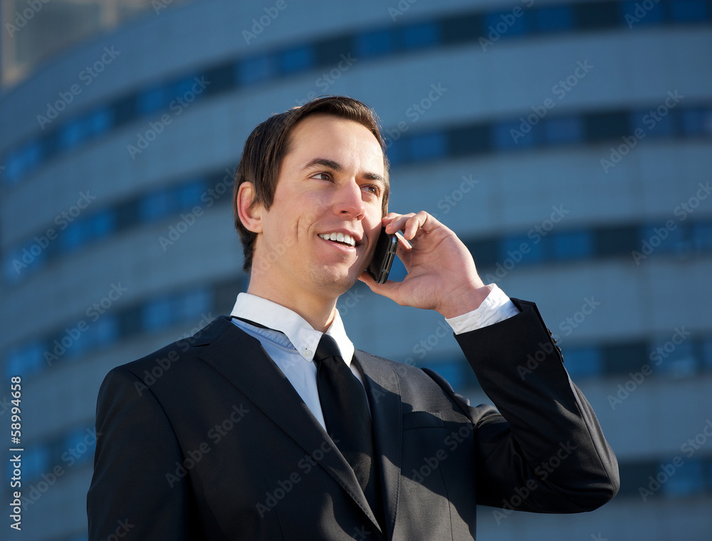 Young business man calling by mobile phone outdoors Young business man calling by mobile phone outdoors