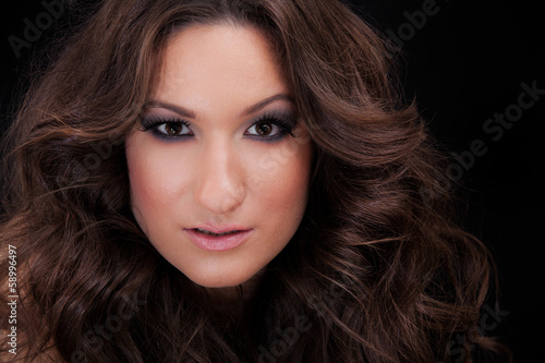 Beautiful Brunette Girl. Beauty Girl's Face.Curly hair