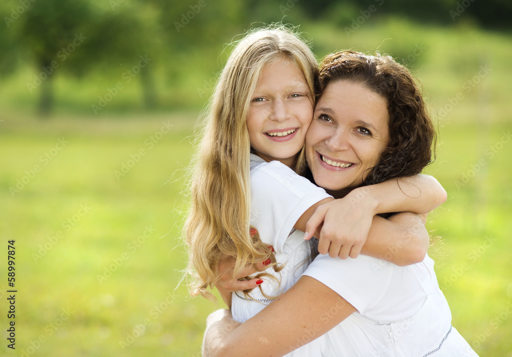 Mother and daughter hugging Mother and daughter hugging