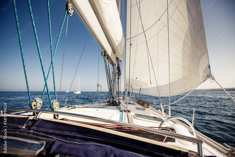 Sailing ship yachts with white sails