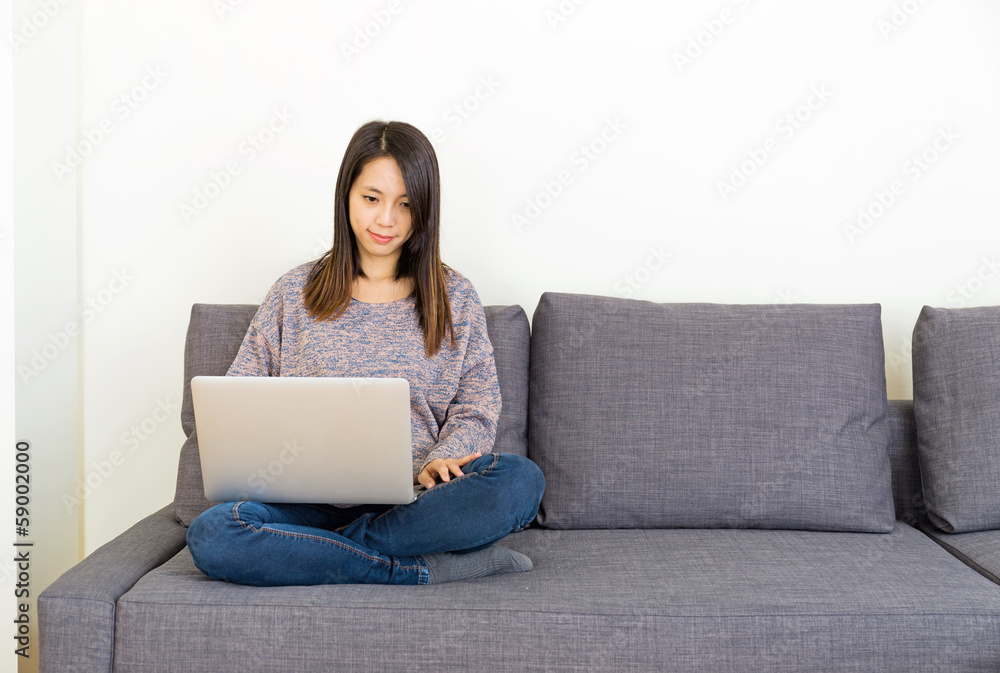 Woman using laptop computer at home Woman using laptop computer at home