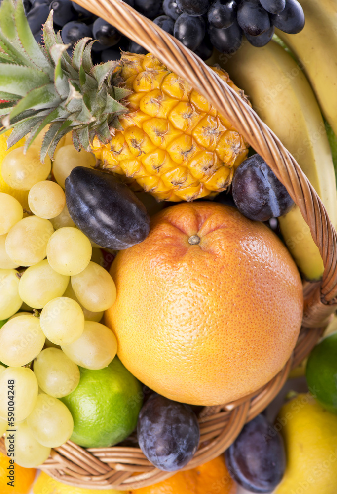 Fresh fruit in a wicker basket close up