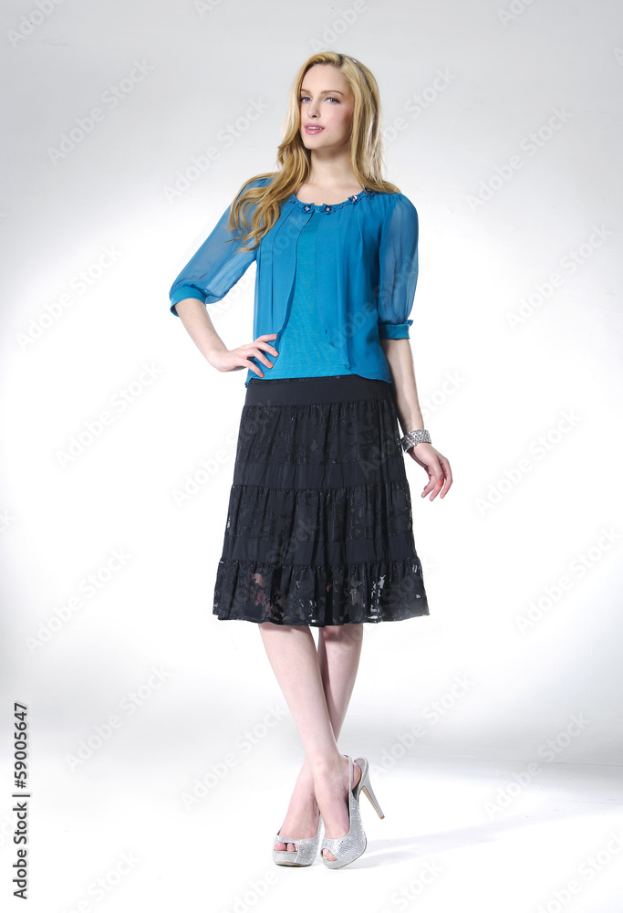 Full body beautiful woman posing on light background Full body beautiful woman posing on light background