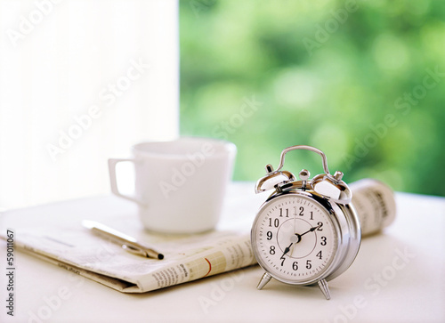 alarm clock and newspaper