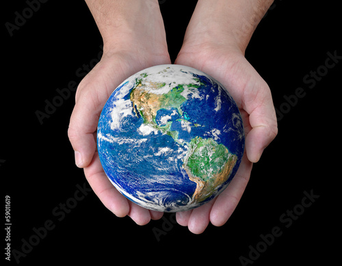 Man holding a globe in his hands.
