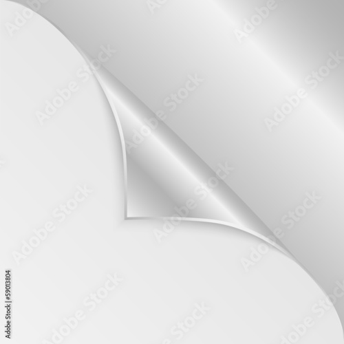 Bblank sheet of paper with the curved  silver corner.clean sheet